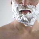 Middle-aged male disappointed and angry because of quality of new shaving foam